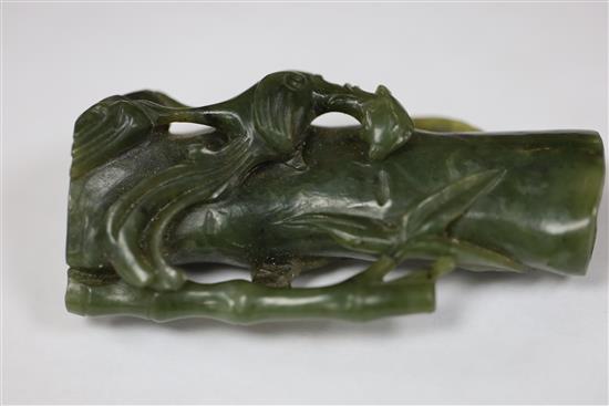 A Chinese archaistic white jade rhyton and a spinach green jade vase, 18th/19th century, H. 11cm and 8.5cm
